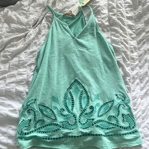 Super cute teal tank top with cut-out design